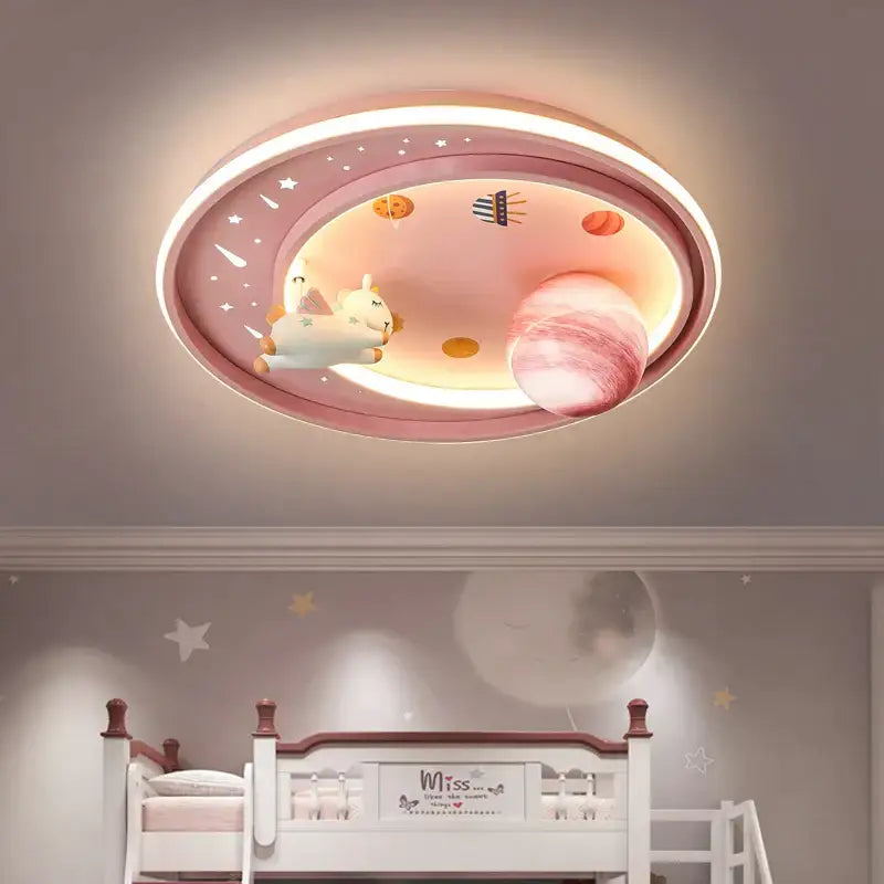 Pink oval ceiling light decorbites astronaut astros featuring a glowing planet and plush unicorn for child’s bedroom