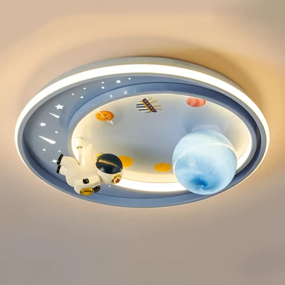 Blue oval-shaped ceiling light with a space theme featuring a cartoon astronaut and planet decor from decorbites astronaut astros