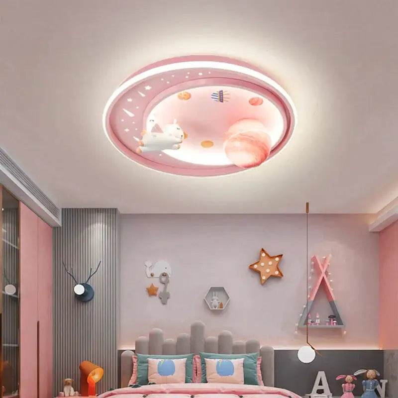 Pink circular ceiling light with glowing unicorn and planets in pastel tones for childs bedroom decorbites astronaut astros planet