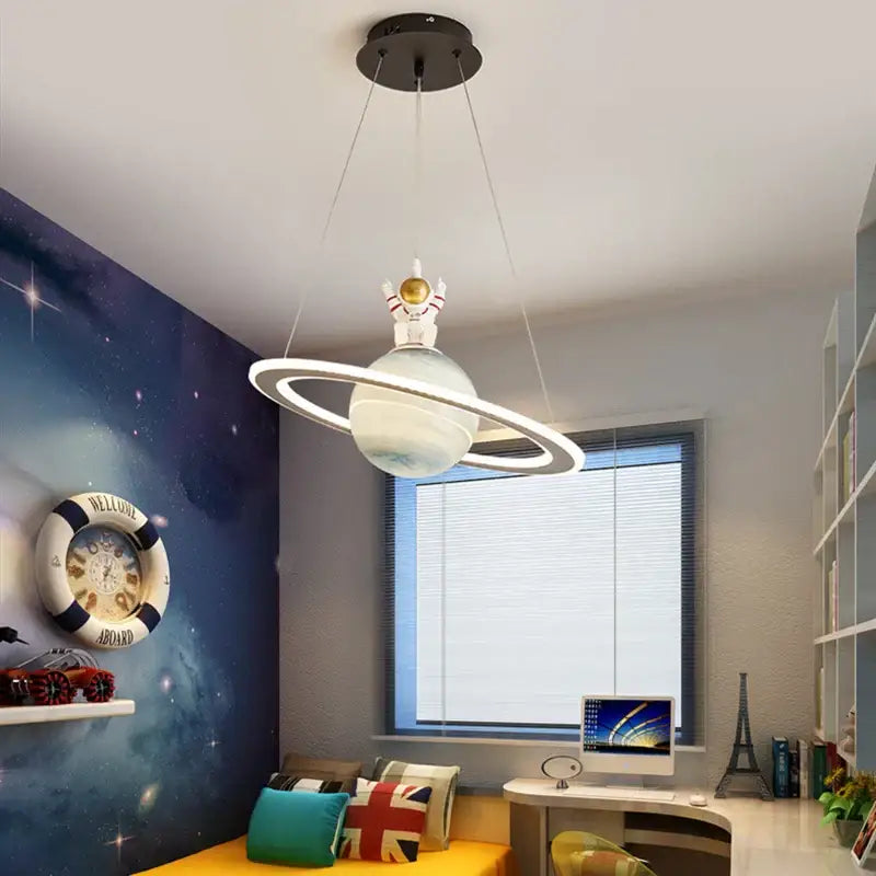 Decorbites astronaut ball led light featuring a white astronaut figurine on a translucent acrylic planet pendant light