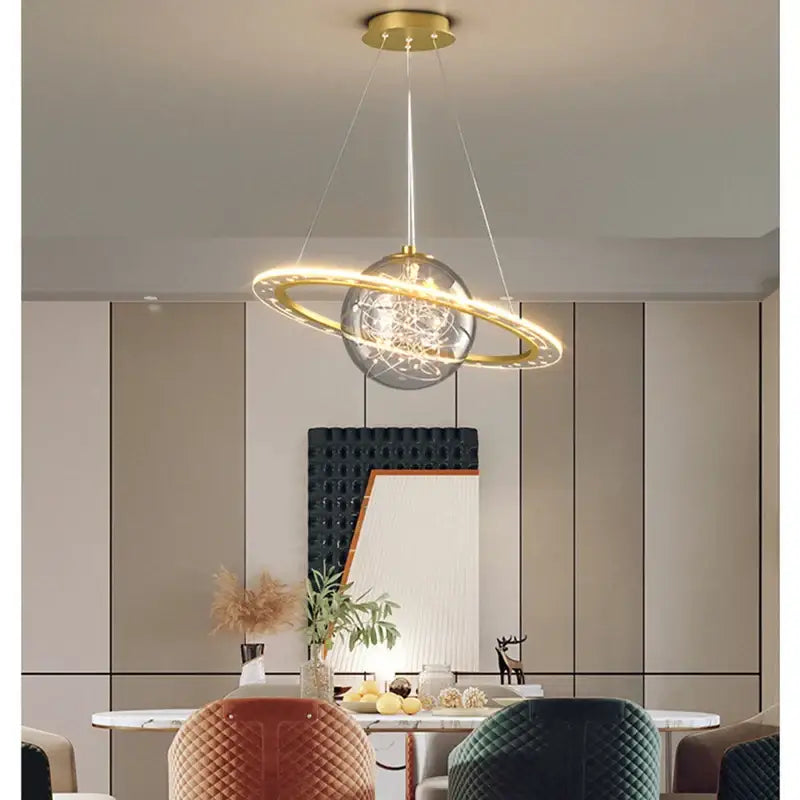 Modern gold-toned decorbites astronaut ball pendant light with clear glass globe led light for boys room decor
