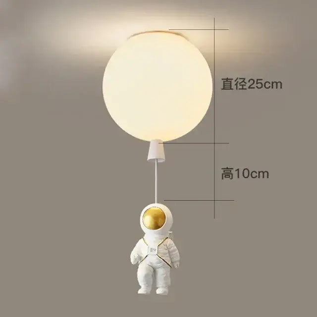 Decorbites astronaut balloon ceiling lamp featuring a white astronaut figurine with gold visor and frosted glass globe light