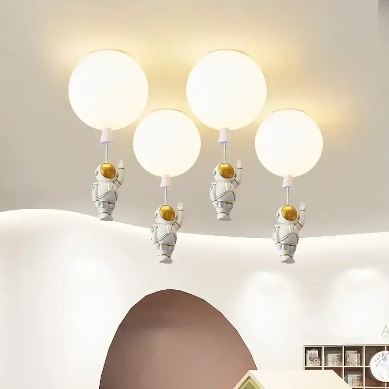 Set of four white decorbites astronaut balloon ceiling lights holding glowing spherical balloons for kids room