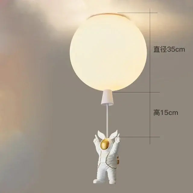 Decorbites astronaut balloon ceiling lamp featuring a white astronaut figurine holding a frosted glass lampshade
