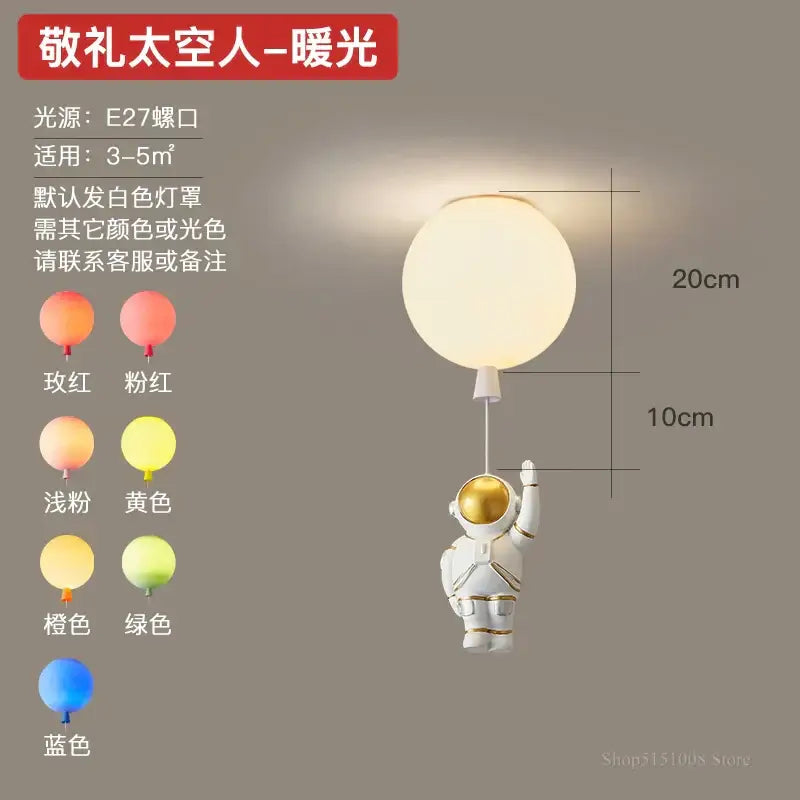 Decorbites astronaut balloon pendant light features a white and gold astronaut figurine holding a warm glowing led balloon