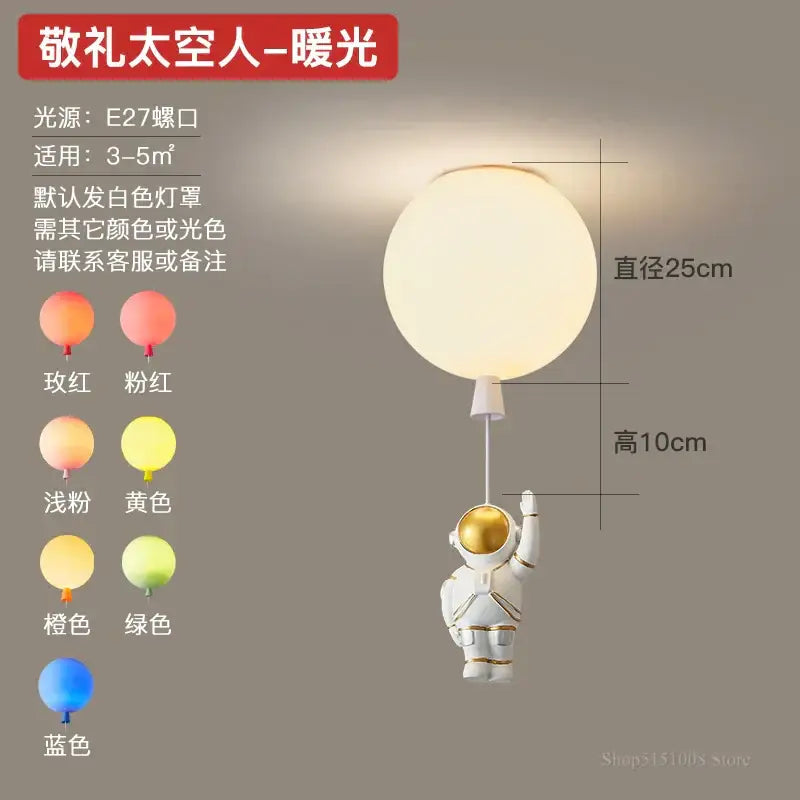 DecorBites astronaut balloon pendant light in white with gold helmet holding frosted globe for nursery room lighting