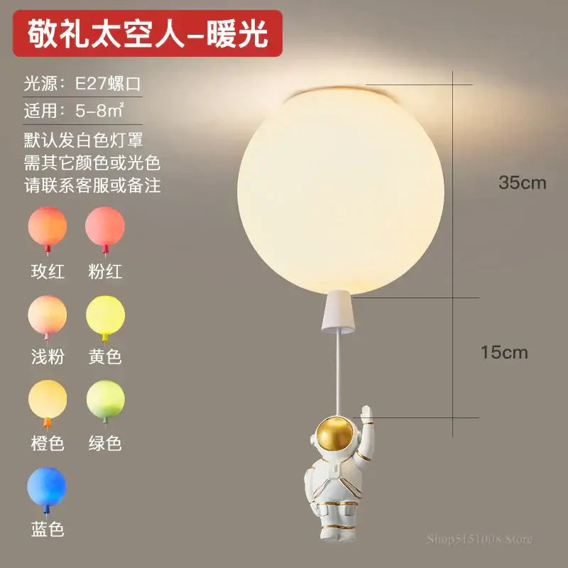 Decorbites astronaut balloon led pendant light featuring a white astronaut figurine with gold accents for nursery rooms
