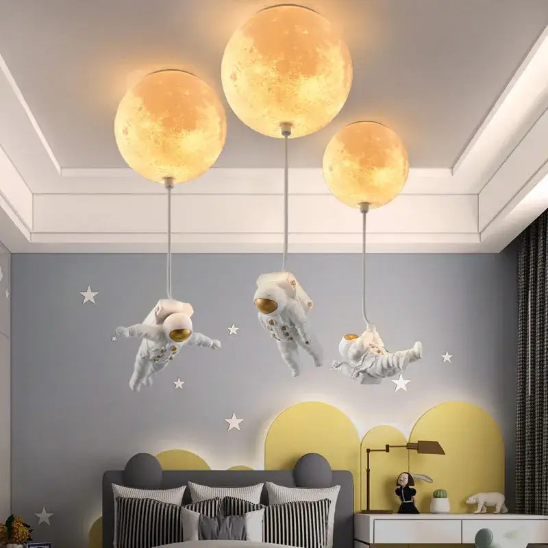 Three glowing textured moon-shaped pendant lights from decorbites astronaut bubble chandelier light for bedroom ceiling