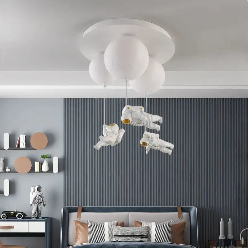 White DecorBites astronaut bubble chandelier light with floating figures suspended by strings for moonlight bedroom ceiling lamp