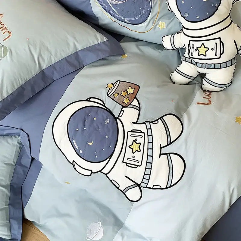 Light blue 100% cotton decorbites astronaut cartoon bedding set featuring a cartoon astronaut holding a starry mug