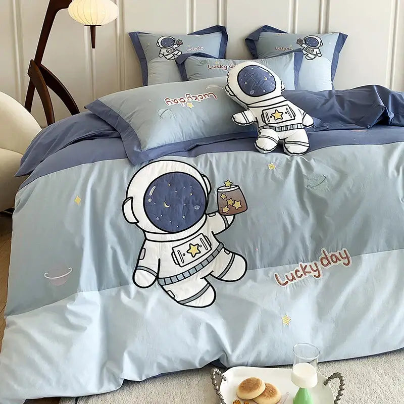 Light blue 100 percent cotton bedding set with astronaut cartoon embroidery stars and lucky day text by decorbites astronaut cartoon