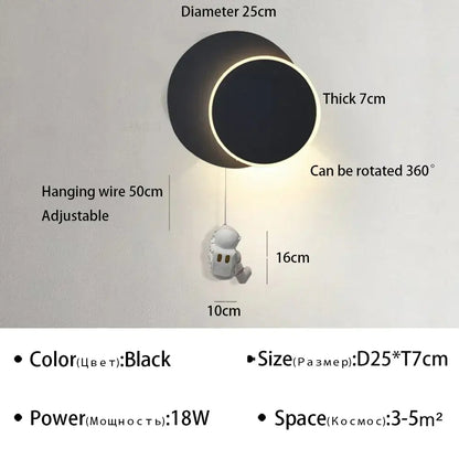 Black circular DecorBites astronaut cartoon wall lamp with glowing LED ring and adjustable hanging wire for modern decor