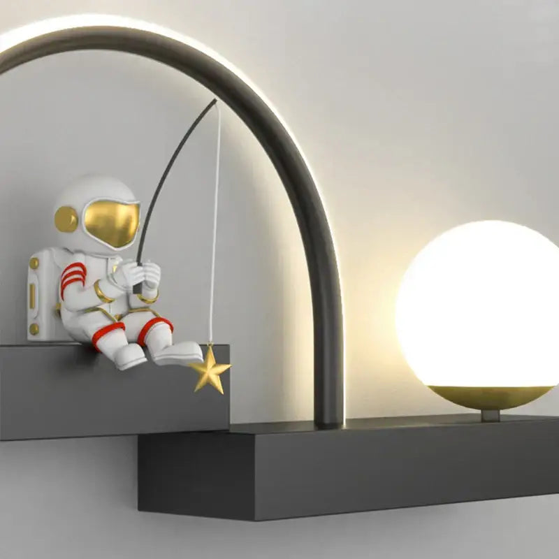 Decorbites astronaut cartoon metal sconce in white with gold visor and red stripes holding a star for living room decor