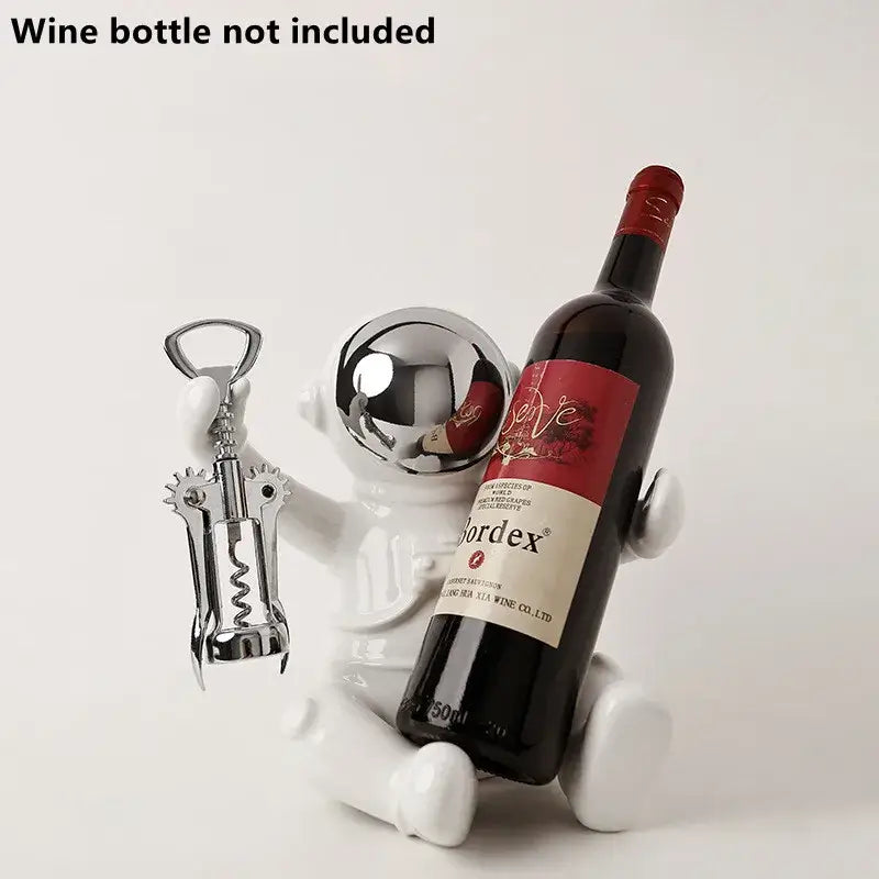 White ceramic astronaut ceramic wine bottle holder with chrome corkscrew accessory by decorbites wine rack