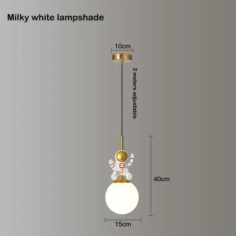 Milky white spherical lampshade with gold-finished astronaut figurine on top suspended by adjustable black cord decorbites astronaut chandelier