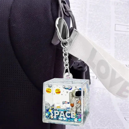 Clear acrylic cube decorbites astronaut drift keychain with space design astronaut planets and glitter confetti inside
