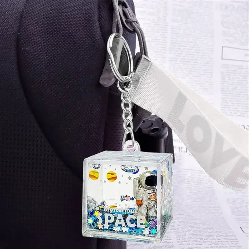 Clear acrylic cube decorbites astronaut drift keychain with space design astronaut planets and glitter confetti inside