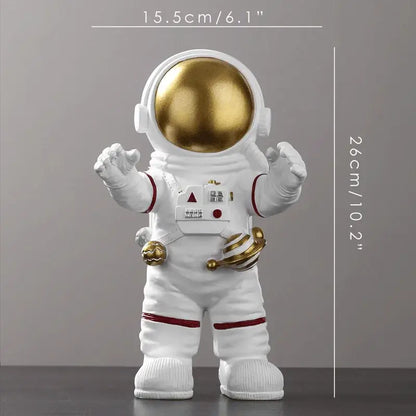 Decorbites astronaut figurine abstract sculpture features a white suit with gold helmet and red accents for modern decor