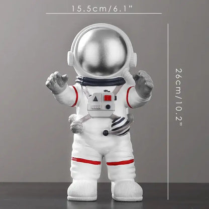 Decorbites astronaut figurine with shiny silver helmet, red accents, and detailed gear in white for modern decor