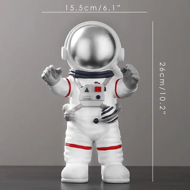 Decorbites astronaut figurine with shiny silver helmet, red accents, and detailed gear in white for modern decor