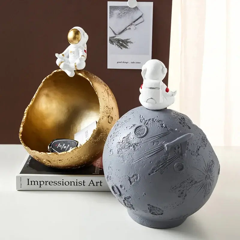 Decorbites astronaut figurine abstract sculpture features white astronaut figures on gold and gray moon-themed bowls for decor