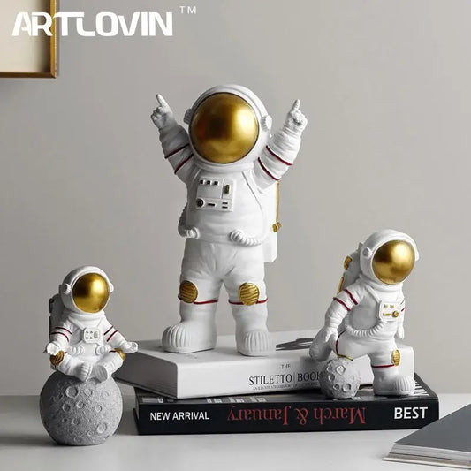 White astronaut figurine with gold visor and red-striped suit details from decorbites astronaut figurines collection