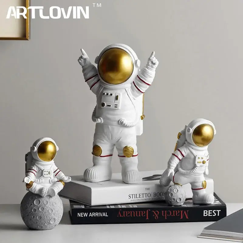 White astronaut figurine with gold visor and red-striped suit details from decorbites astronaut figurines collection