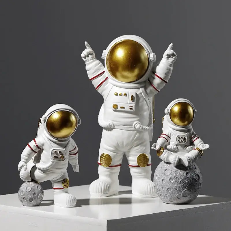 White decorbites astronaut figurines with gold helmets and accents in detailed space suits, ideal gift for man and boyfriend