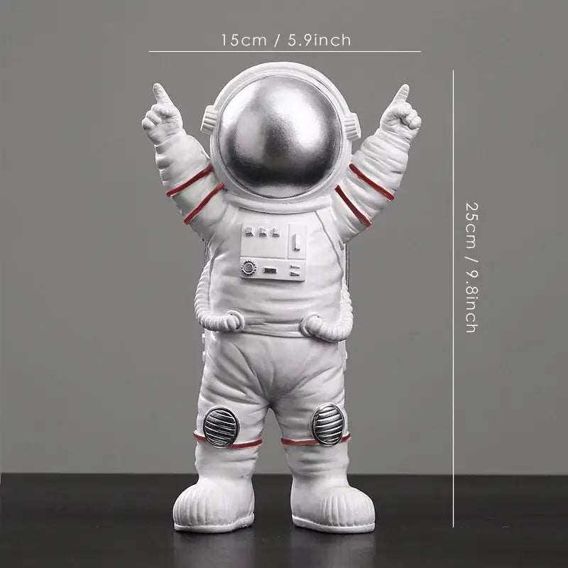 White astronaut figurine with shiny silver helmet and red accents from decorbites astronaut figurines collection