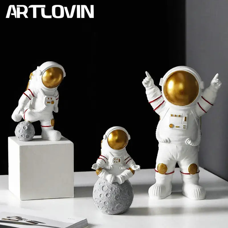 White astronaut figurines with gold visors and red-striped suits by decorbites astronaut perfect gift for man and boyfriend