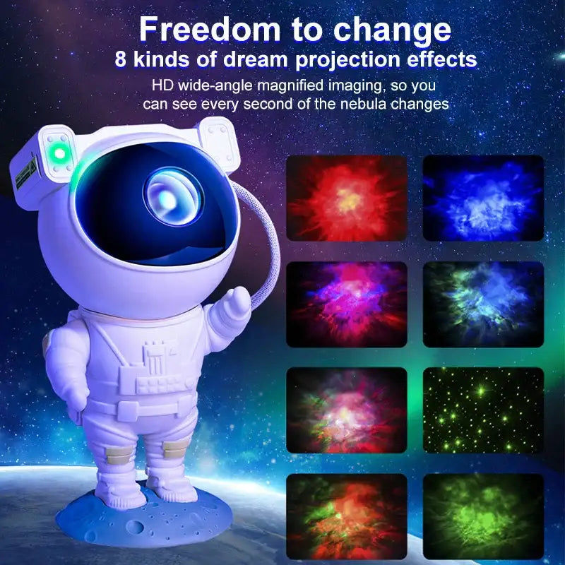White decorbites astronaut galaxy night light projector with glowing green eye and blue lens projecting colorful nebula effects