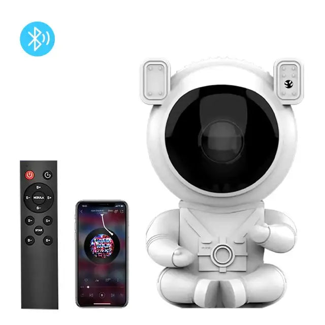 White astronaut-shaped bluetooth speaker with black face and sensor panels in decorbites astronaut galaxy starry sky night light