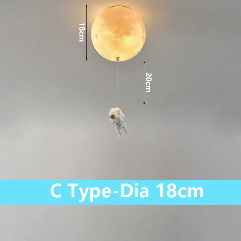 Warm-toned 18cm spherical decorbites astronaut globe ceiling light with a dangling astronaut figure for kids room