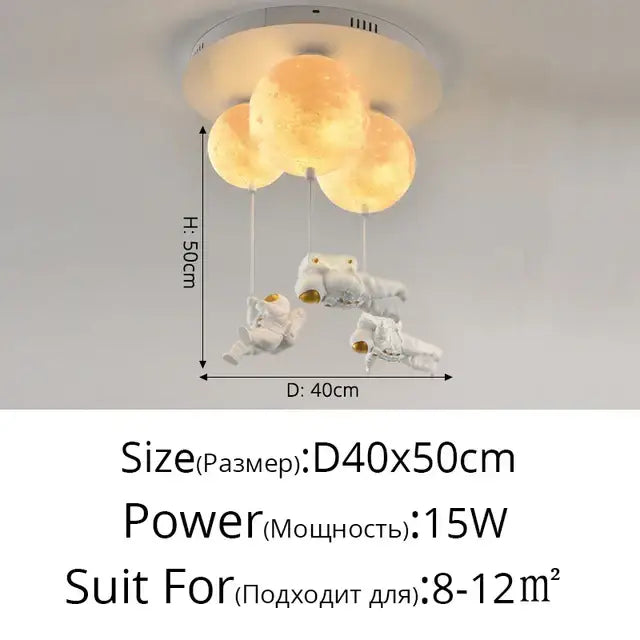 A decorbites astronaut globe ceiling light featuring three glowing moon orbs suspended above white astronaut figures