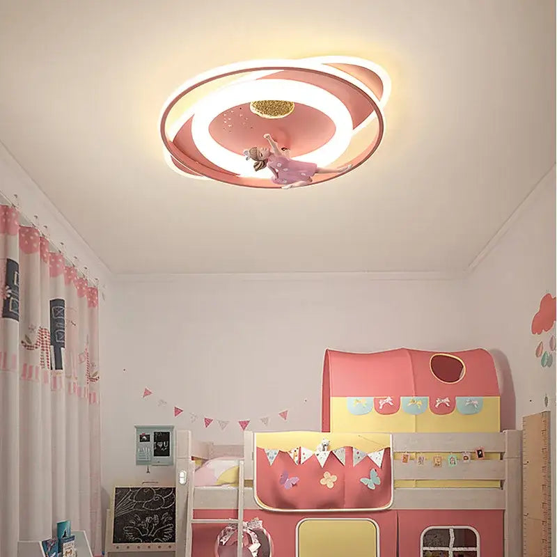 Pink circular ceiling light with concentric rings and central golden glittery disc for decorbites astronaut kids bedroom