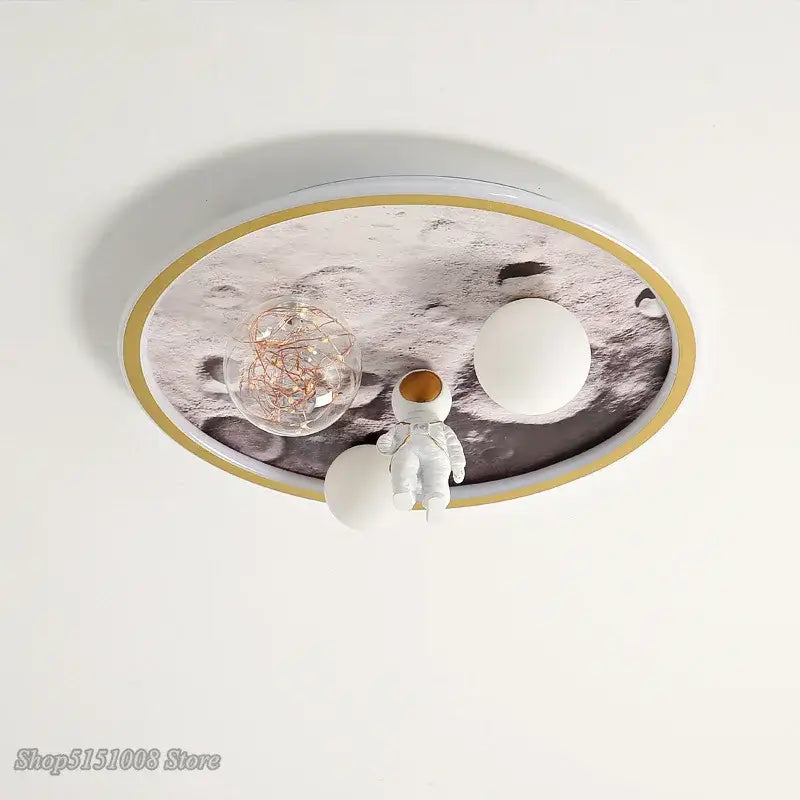 Oval-shaped decorbites astronaut led ceiling light with moon surface design gold trim and astronaut figurine for kids bedroom