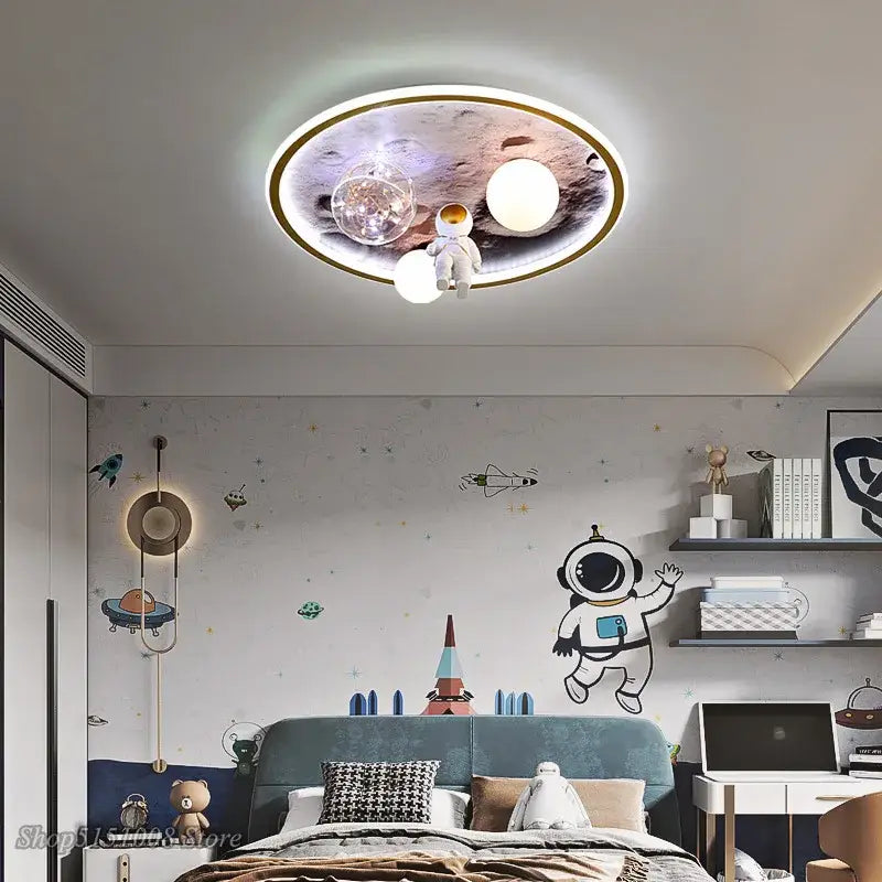 Circular decorbites astronaut led ceiling light featuring a space-themed design with astronaut figurine and glowing orbs