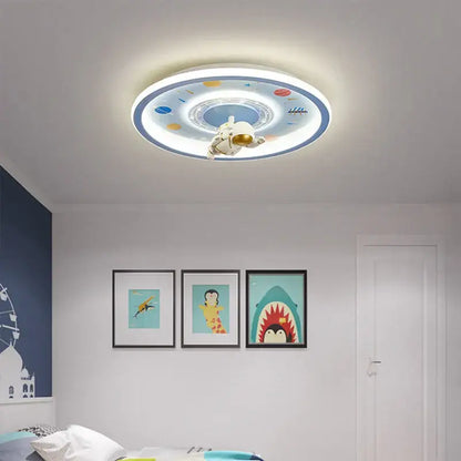 Circular decorbites astronaut led ceiling light with white astronaut figurine and colorful blue cartoon space design