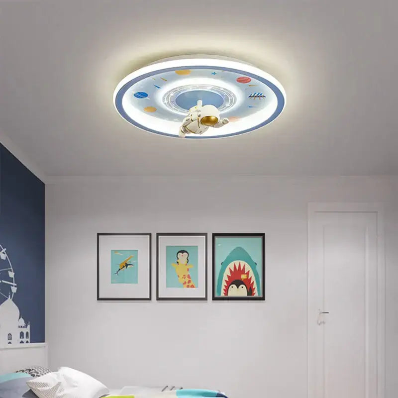 Circular decorbites astronaut led ceiling light with white astronaut figurine and colorful blue cartoon space design