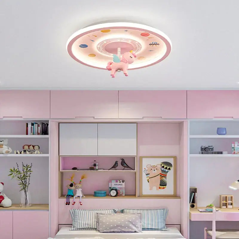 Pink circular ceiling light with whimsical unicorn figurine featured in decorbites astronaut led ceiling light for kids room