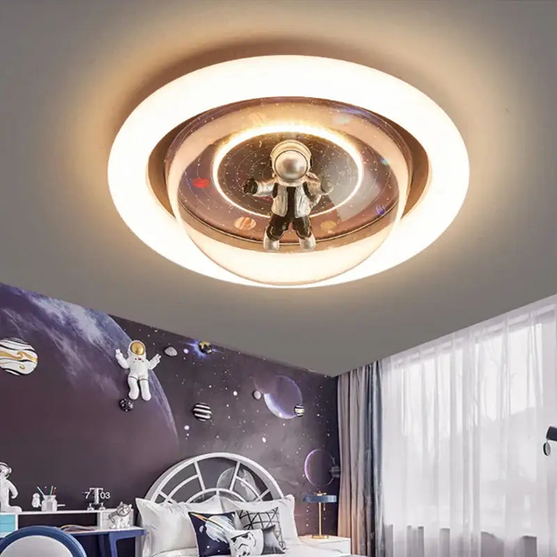 Circular decorbites astronaut led ceiling light with translucent multi-layered design featuring floating astronaut and planets