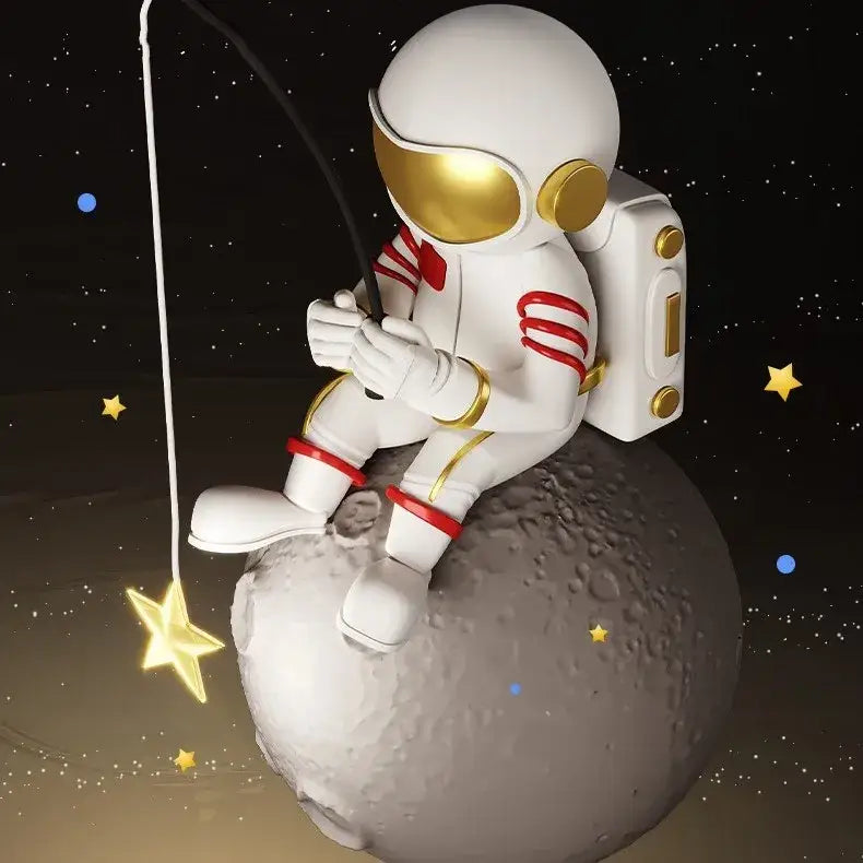 White astronaut figurine with gold visor sitting on moon surface fishing for stars in decorbites astronaut led chandelier