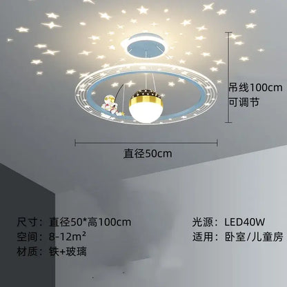 Whimsical blue and gold decorbites astronaut led chandelier with cartoon astronaut fishing and star-shaped led lighting patterns