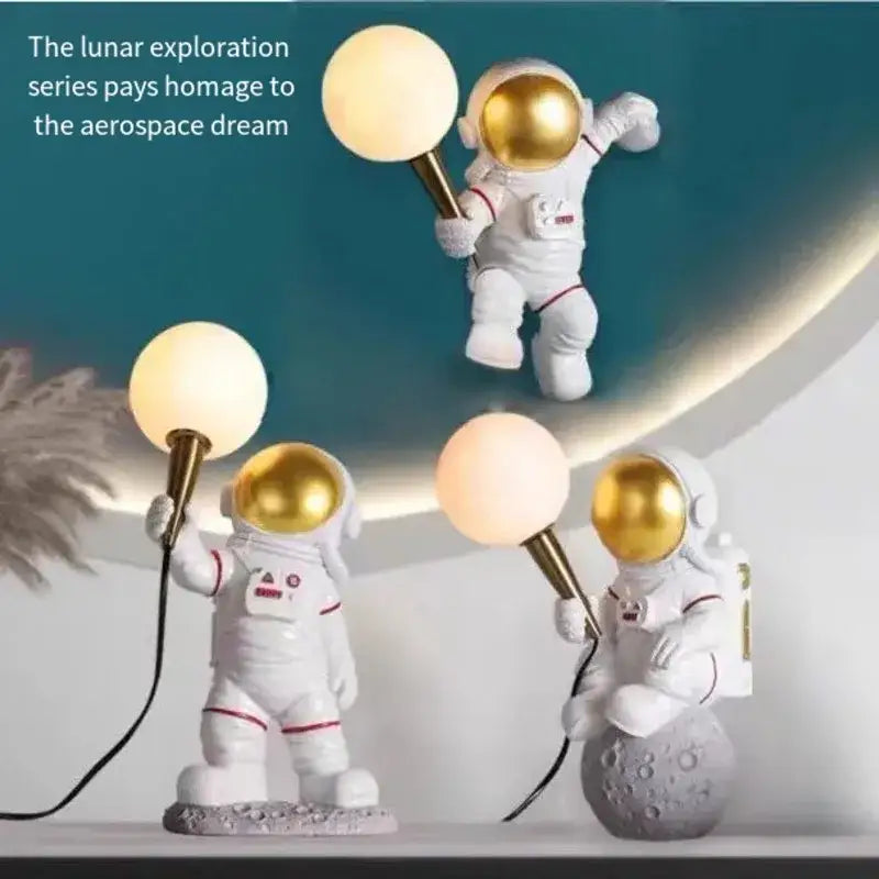 DecorBites™ astronaut led table lamp featuring white resin figures with gold helmets holding spherical lamps for kids room