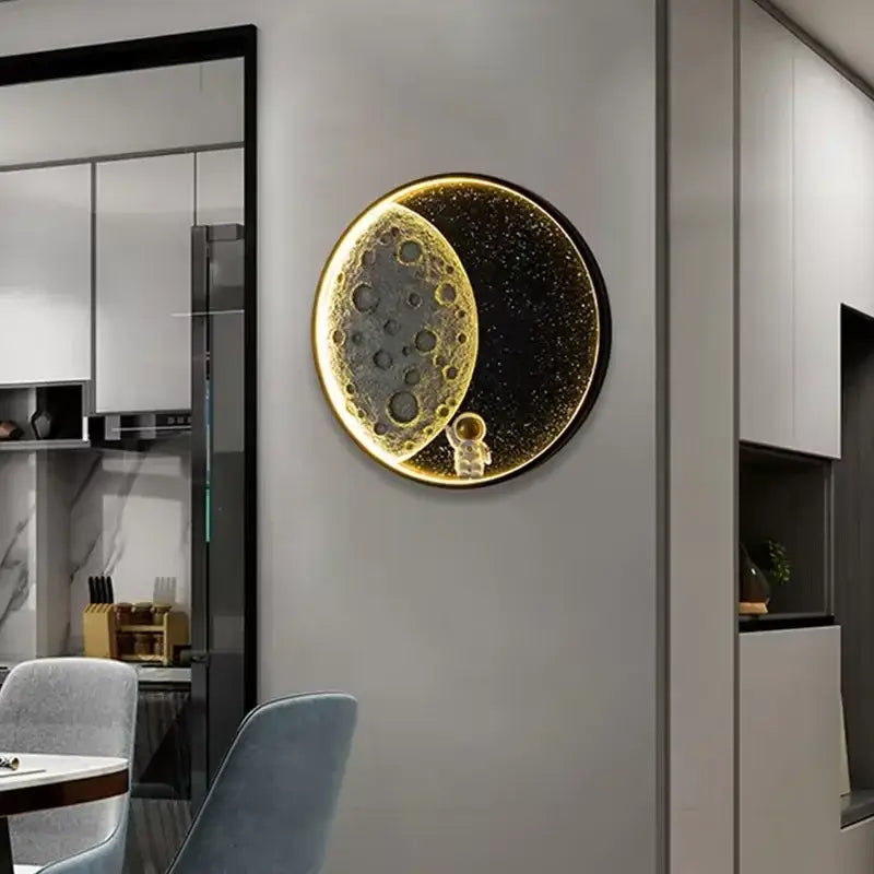 Decorbites™ astronaut led wall lamp featuring a circular illuminated moon surface with gold lighting and resin astronaut decor