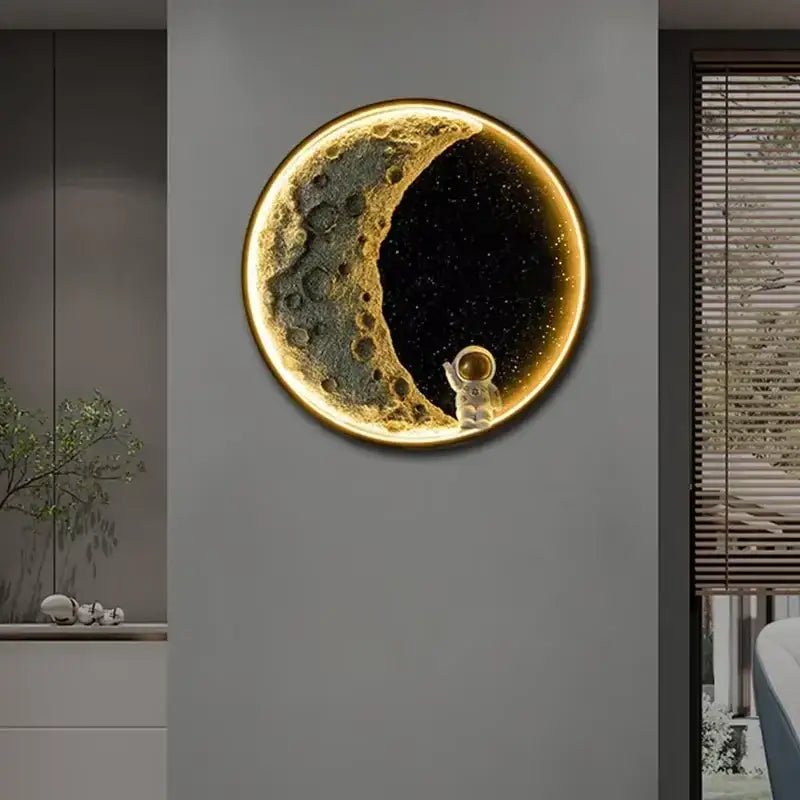 Decorbites™ astronaut led wall lamp featuring a glowing circular moon with metallic gold crescent and resin astronaut figurine