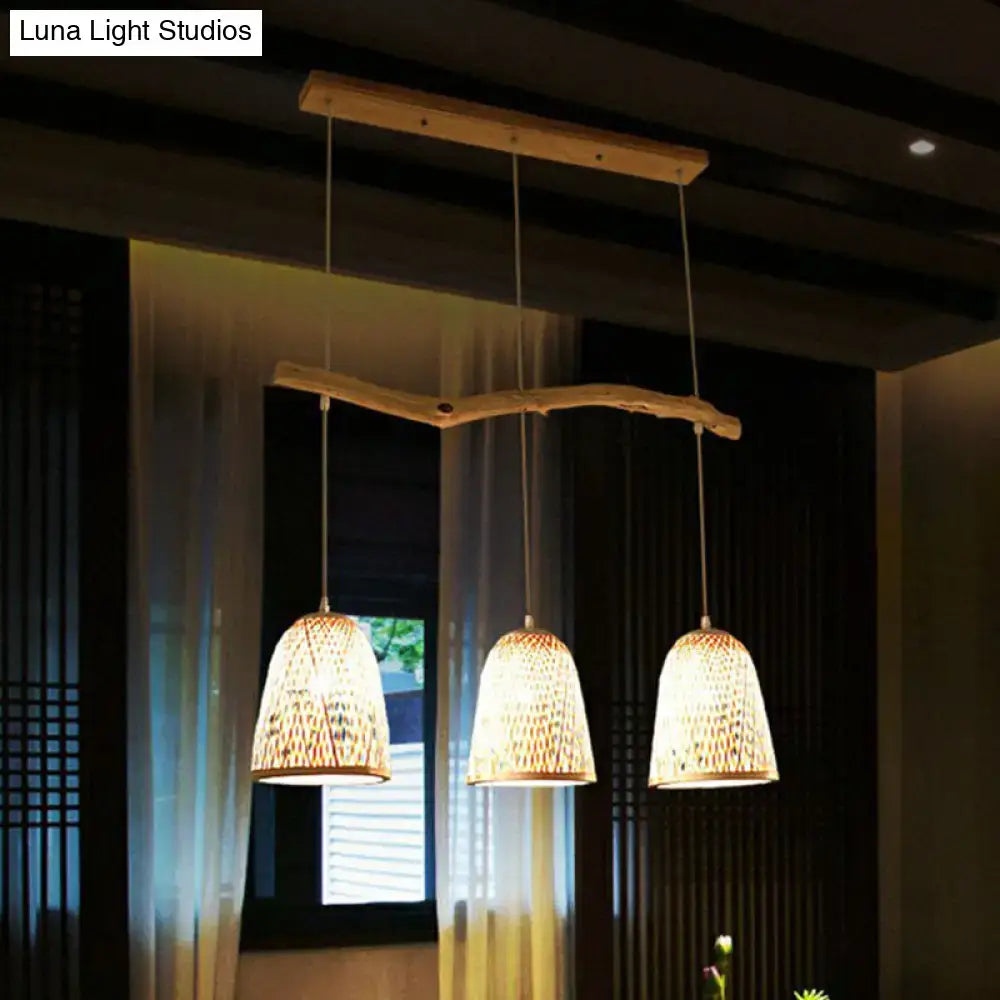 Three bamboo bell shade pendant lights with wood finish hang from a rustic beam for Southeast Asian tea room lighting