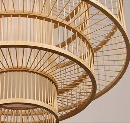 A decorbites bamboo ceiling chandelier with a tiered spiral woven design in natural light wood finish for garden use
