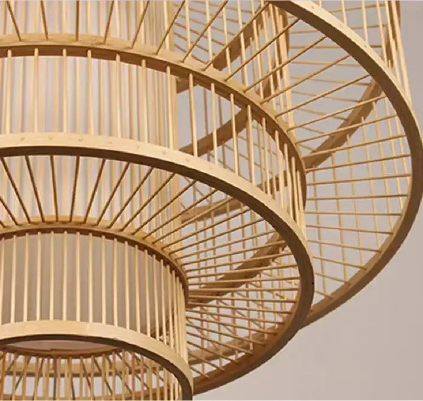 A decorbites bamboo ceiling chandelier with a tiered spiral woven design in natural light wood finish for garden use