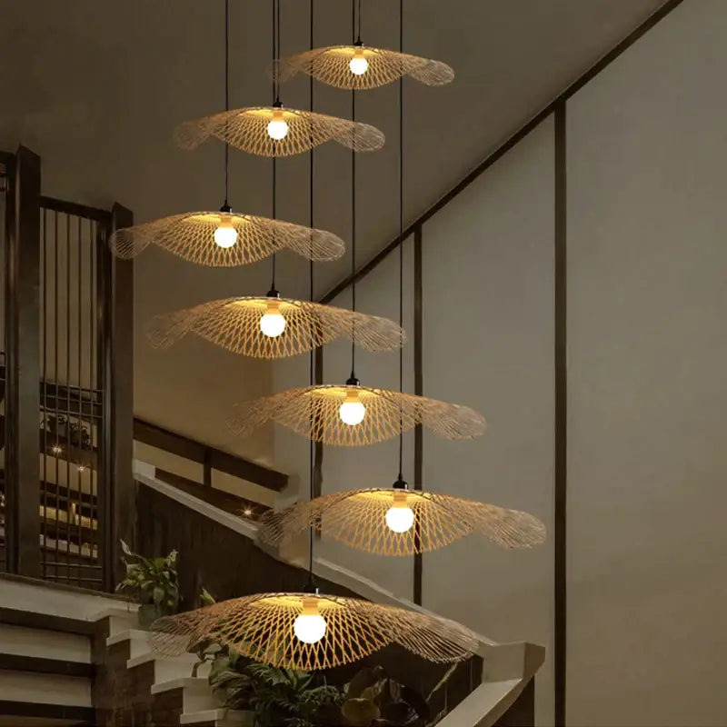 A set of six warm-toned woven bamboo pendant lights in a natural design for decorbites bamboo chandelier